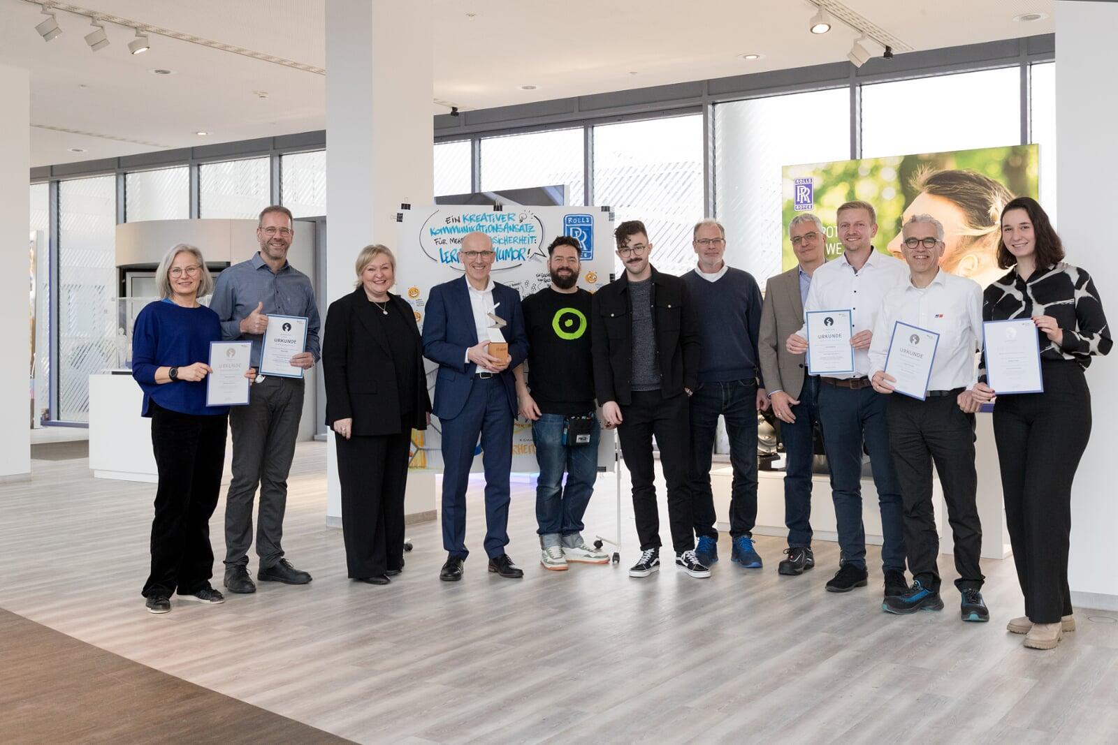 Lernen mit Humor: Rolls-Royce gewinnt in Zusammenarbeit mit TheCORE den Silbernen Sicherheitspreis der BGHM